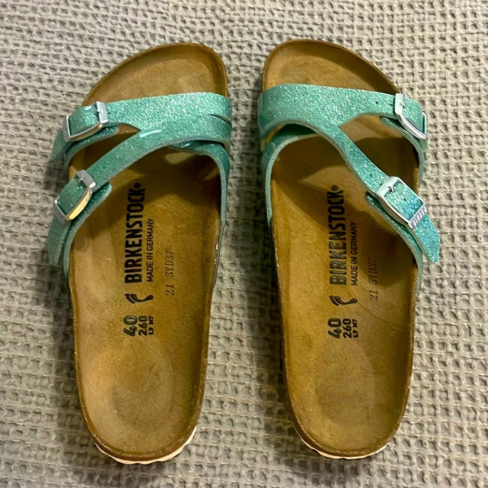 Size 40 turquoise glitter Birkenstocks.  Never worn, in perfect condition.